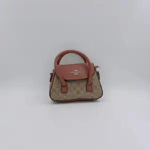 Andrea Mini Carryall Bag In Signature Canvas - image 50