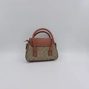 Andrea Mini Carryall Bag In Signature Canvas - image 49